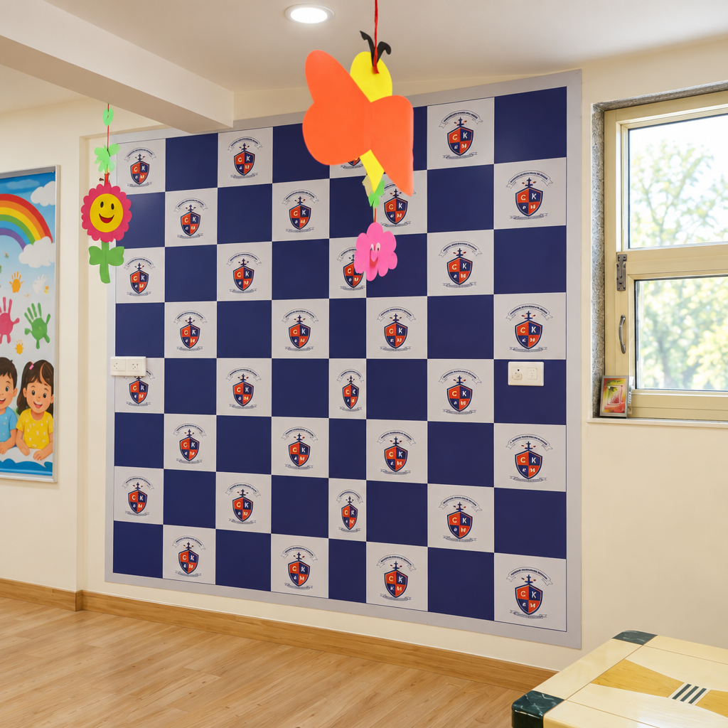 Branded stage backdrop at Cambridge Montessori Shalimar Bagh